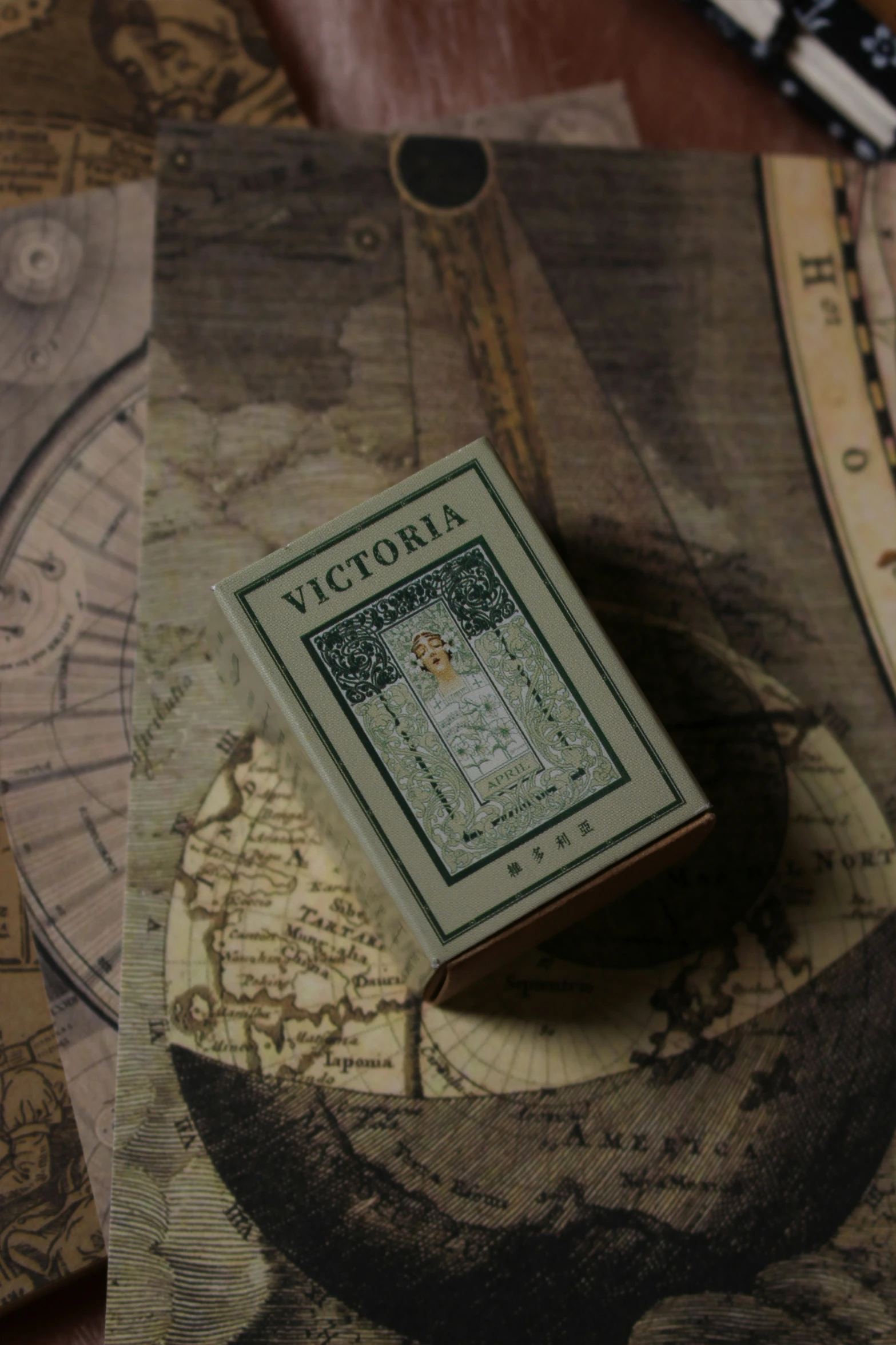 a close up of a game box on a wooden table