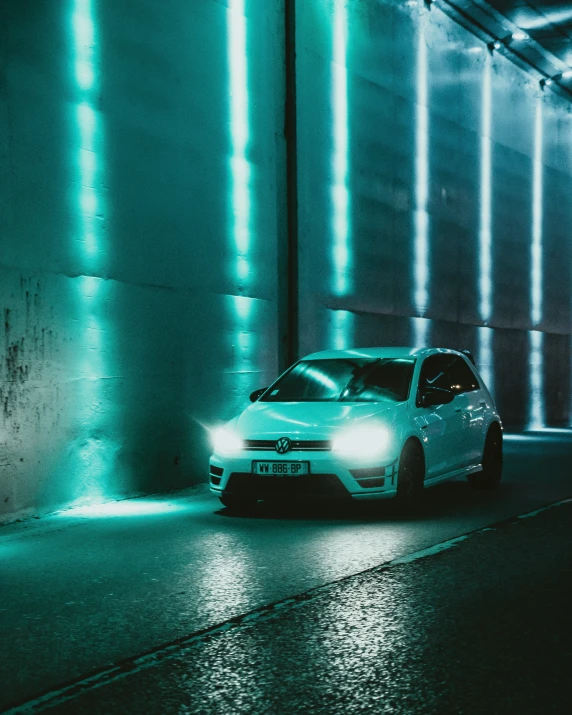 a car parked in a very dark car parking lot