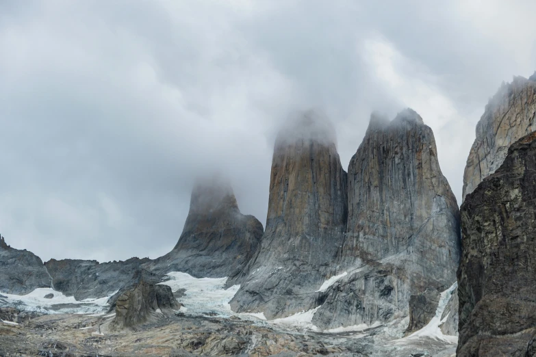 some tall mountains with a lot of clouds