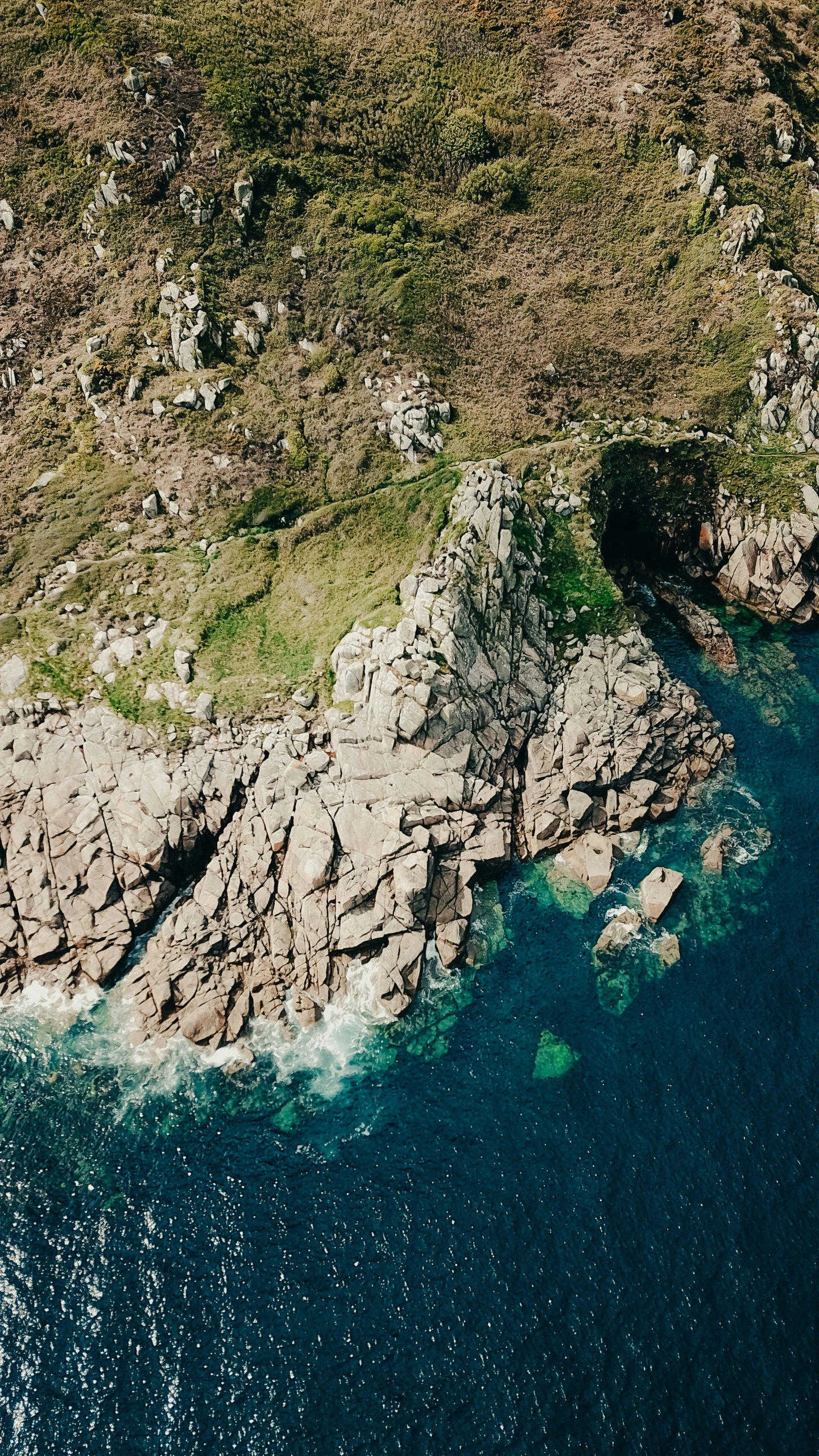 an overhead s of two small rocky cliffs on the coast