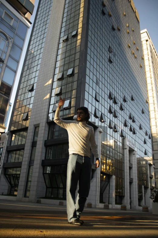 a young man skateboards along a city street