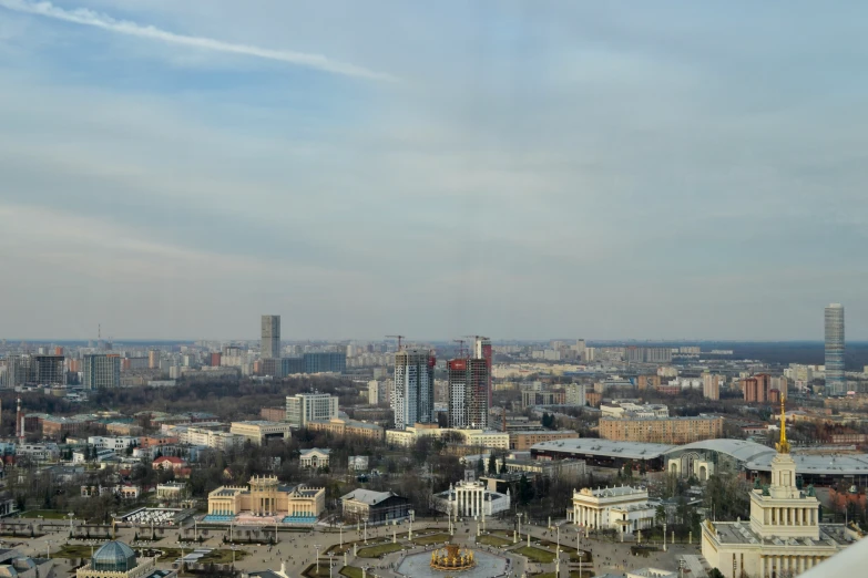 the city skyline has several buildings with a tower in the middle