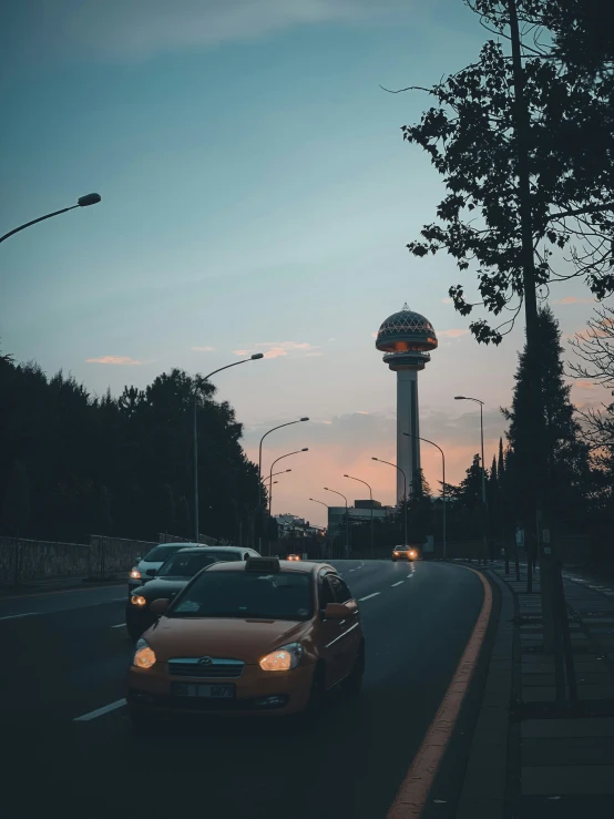 a car stopped in front of an electronic tower