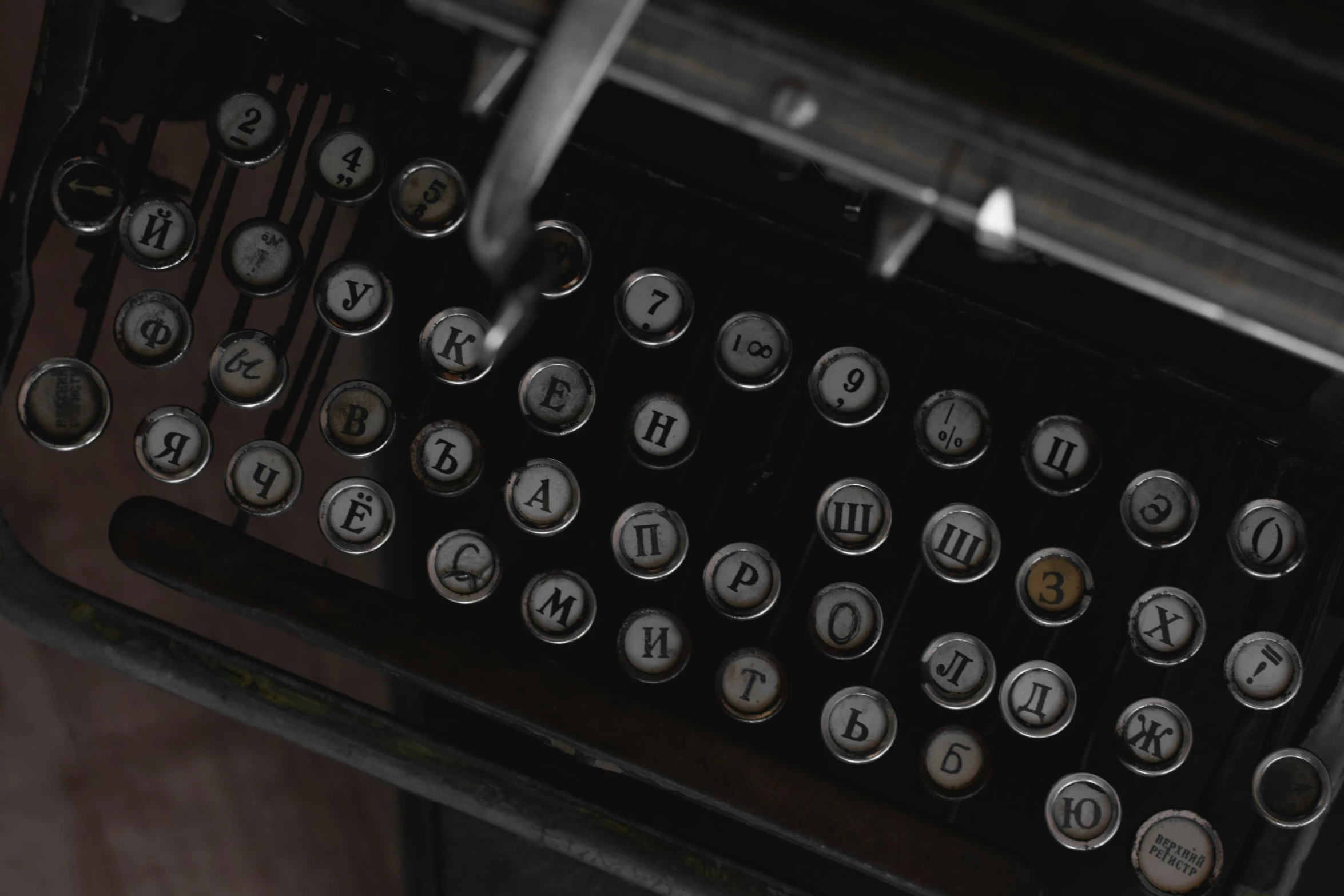 close up image of a typewriter with keys and letters on it