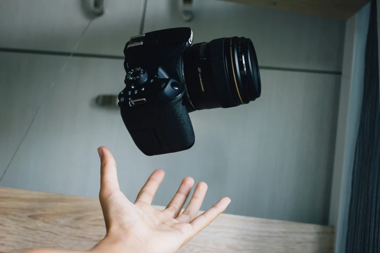 a person's hand is up toward a camera, and the image is overlaided