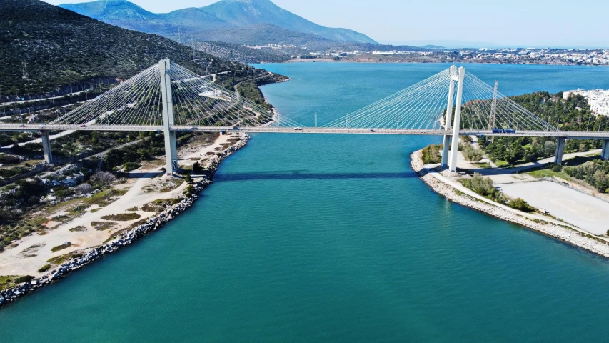 an aerial view of a bridge that is open over water