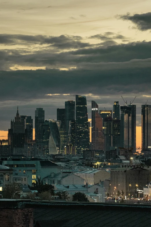 a pograph of a city skyline in a cloudy night