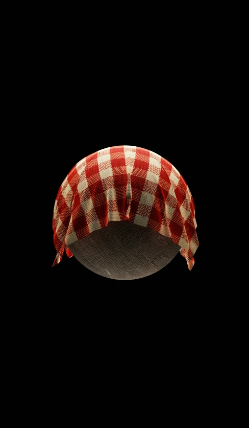 a red and white checkered table cloth is hanging