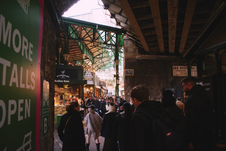 a group of people walk around a city center