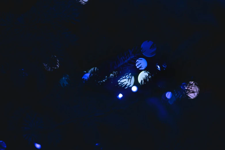 a black background with blue and purple lights