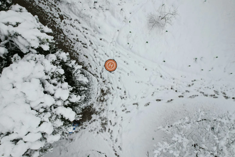 a picture from the air with snow on top and two umbrellas