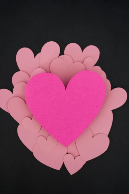 the heart is made up of hearts on pink foam