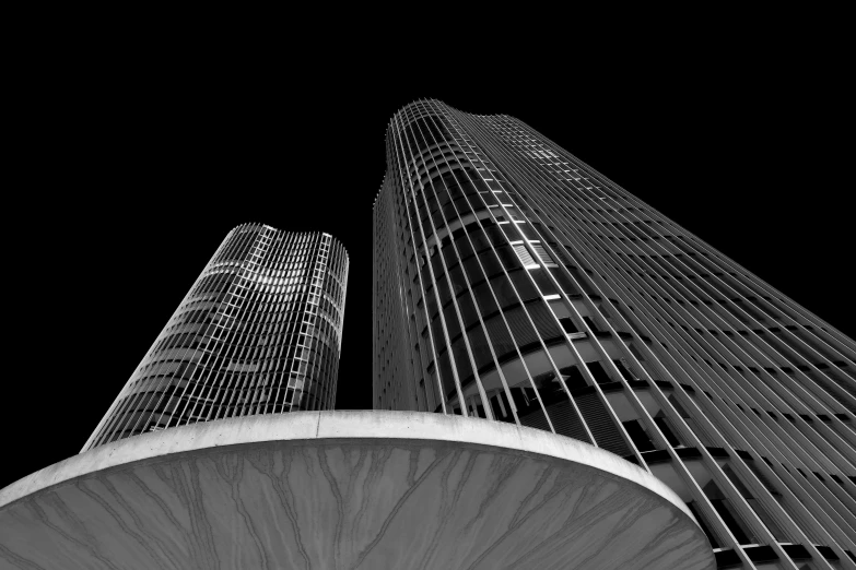 looking up at the top of two tall buildings