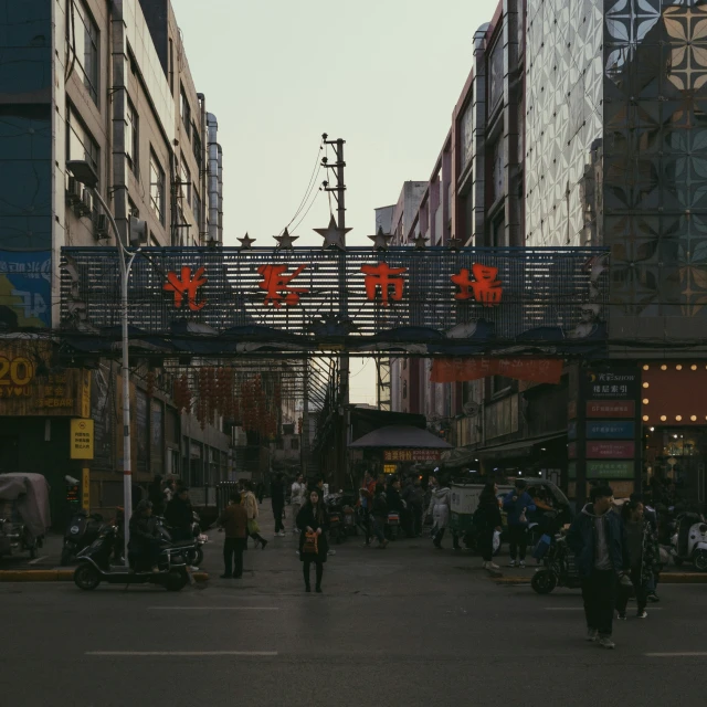 a large number of people walk on a city street