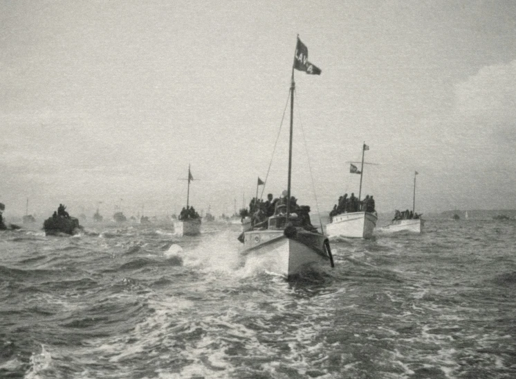 a fleet of ships sail through the water