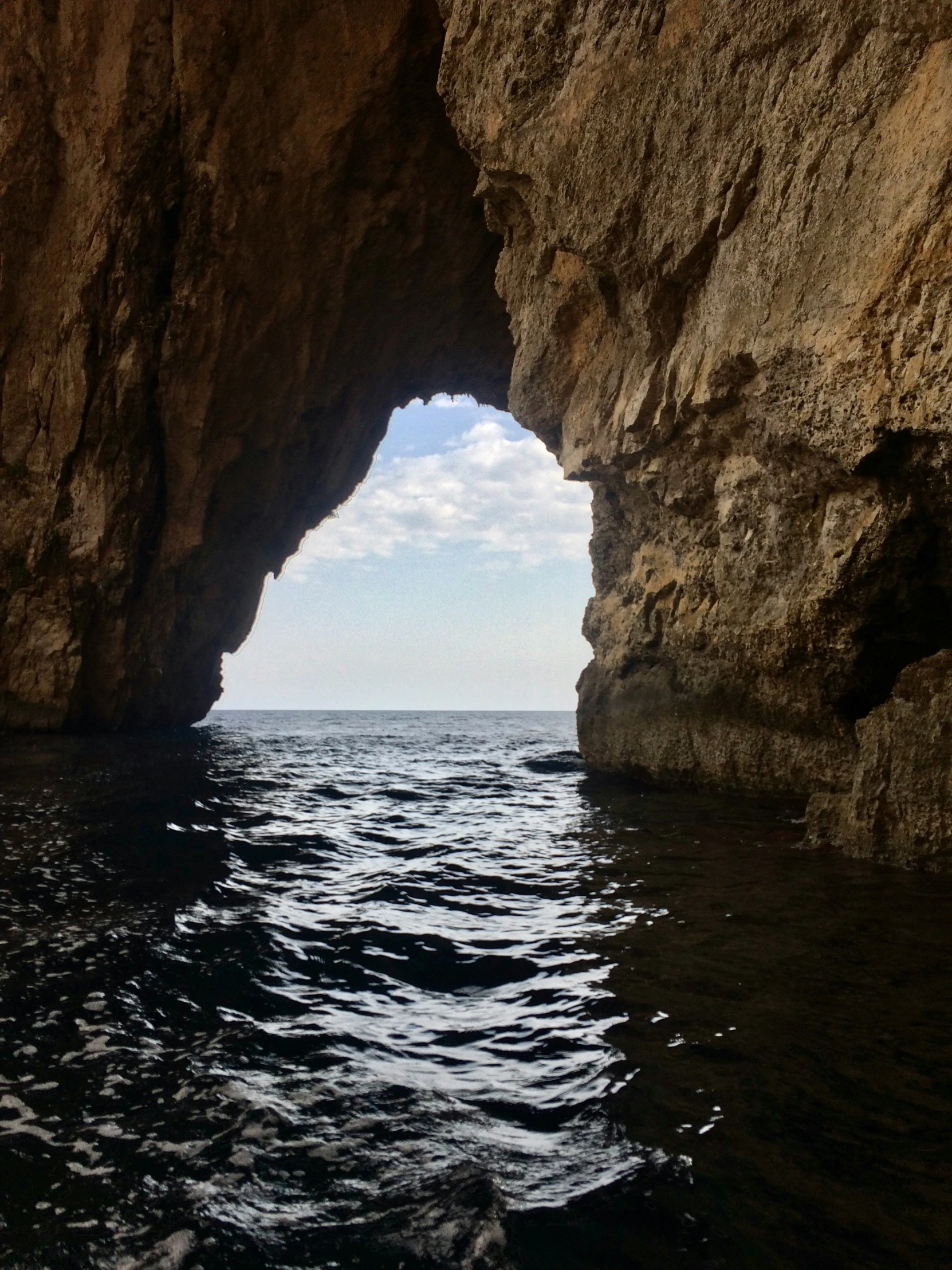 an opening in the side of a large rock formation