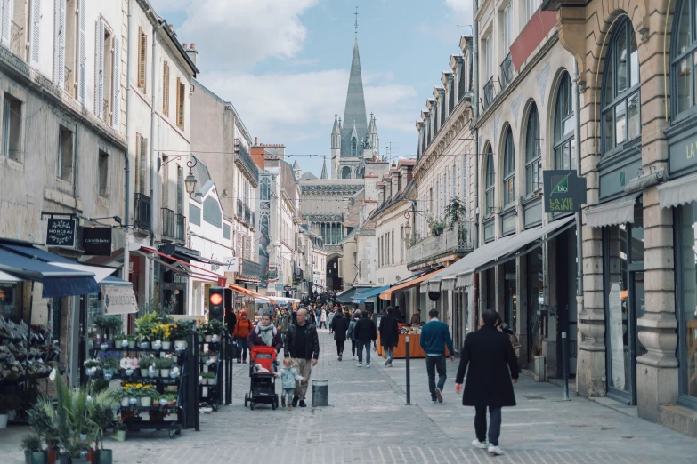 people walking in the city between buildings