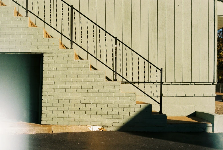 a skateboarder doing a trick down an incline on a wall