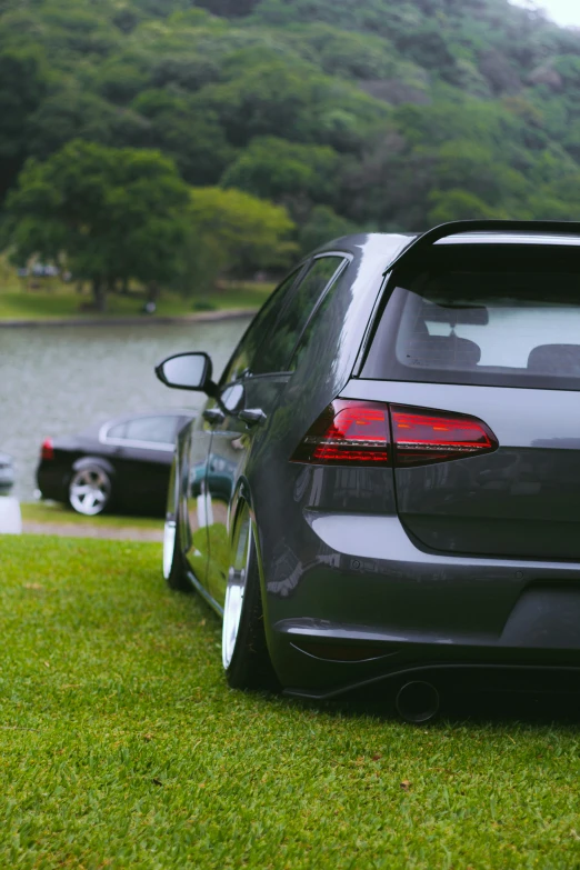 some cars parked near a body of water