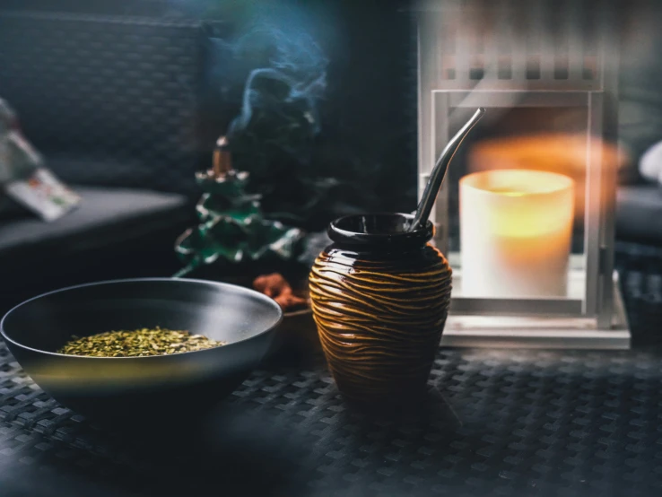 a close up of a cup and spoon on a table