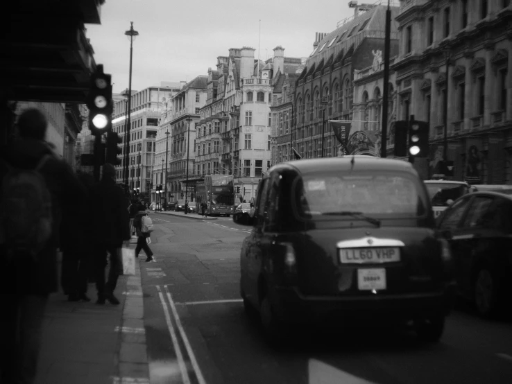 a black and white po of buildings in the background