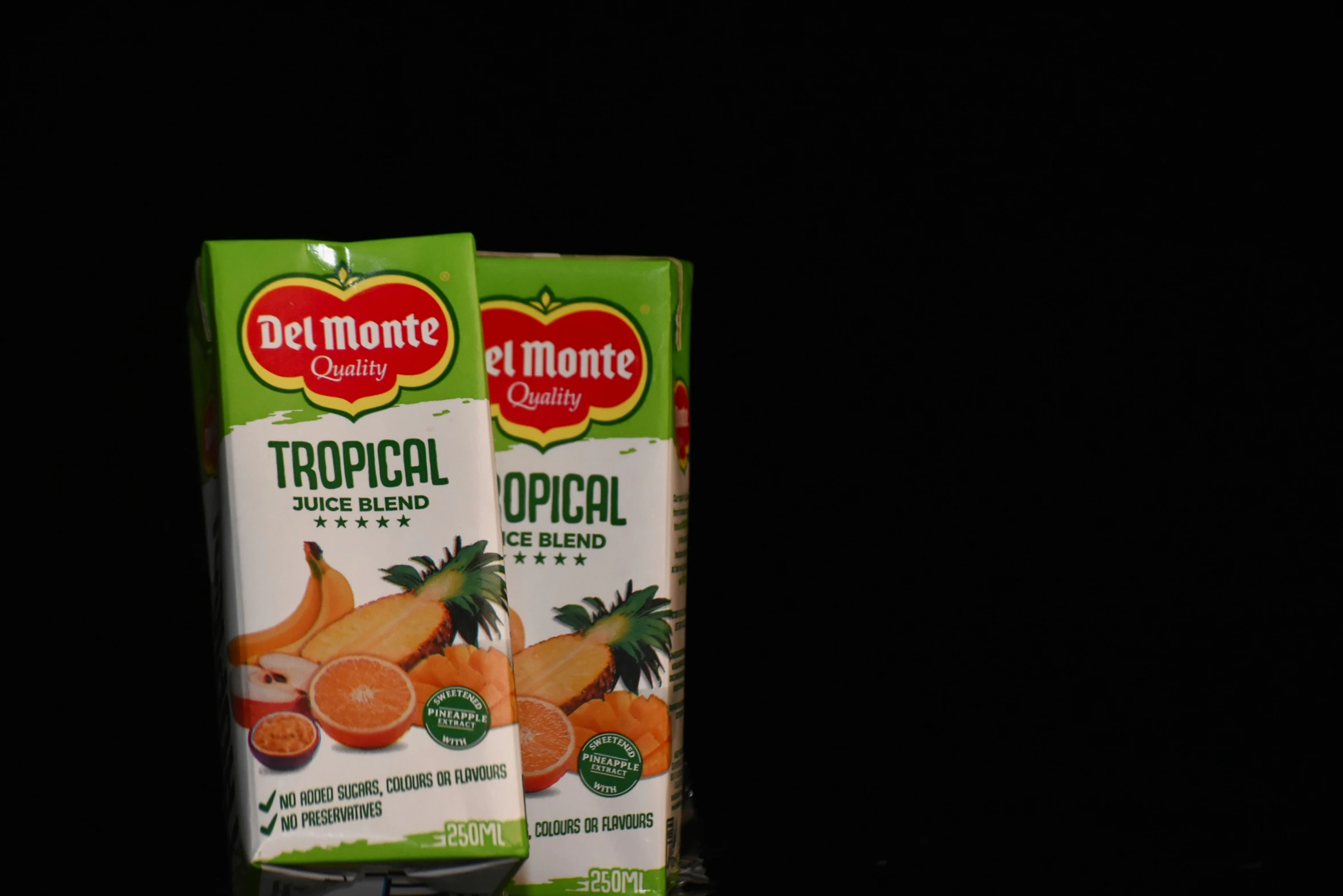 two cartons of de monte orange juice