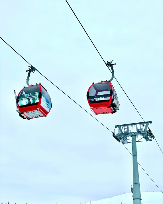 a ski lift going up the side of a ski slope