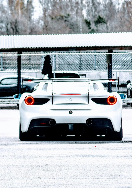 the back end of a race car in snow