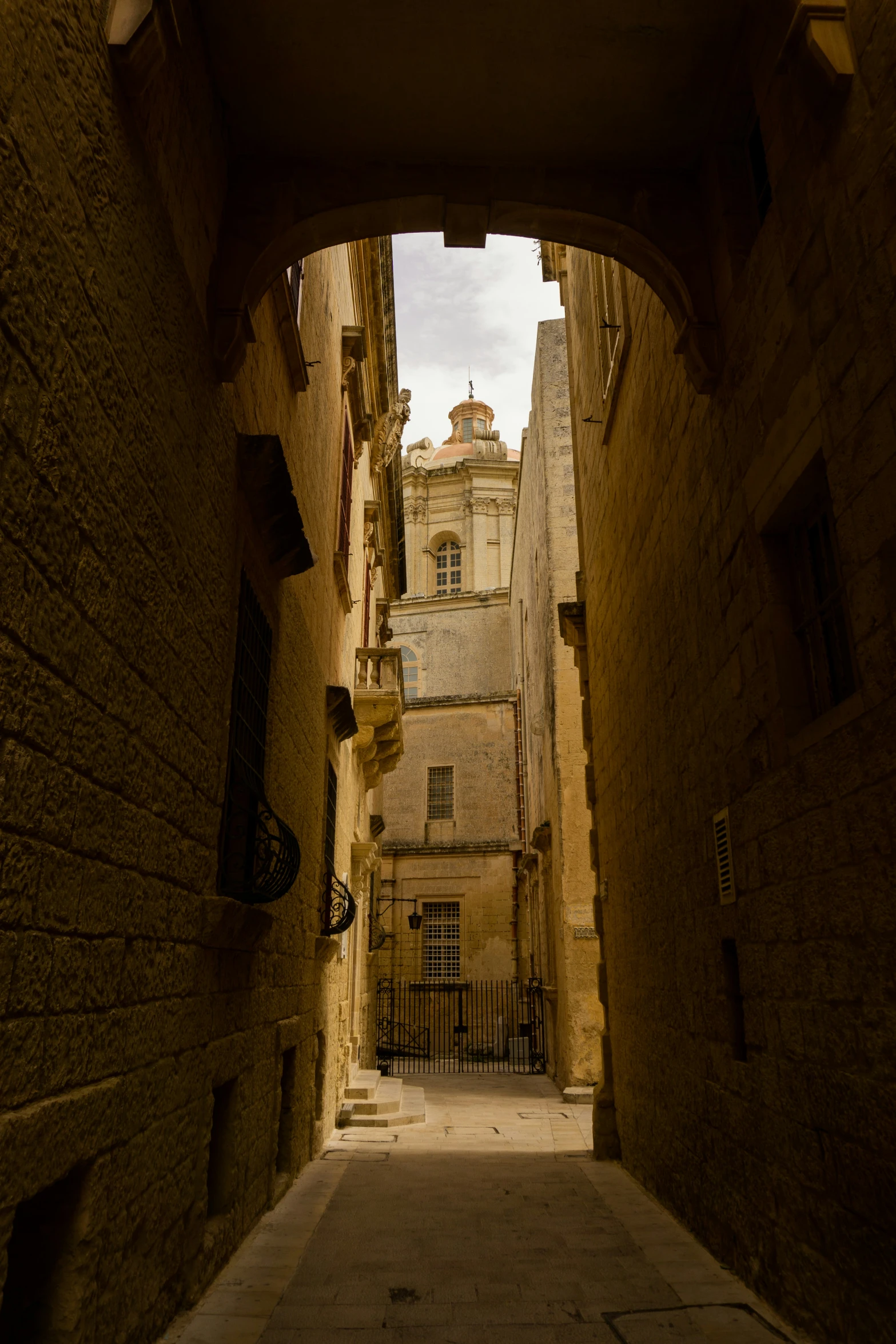 a narrow street is full of old buildings