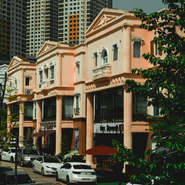 a row of building on the street with a few cars