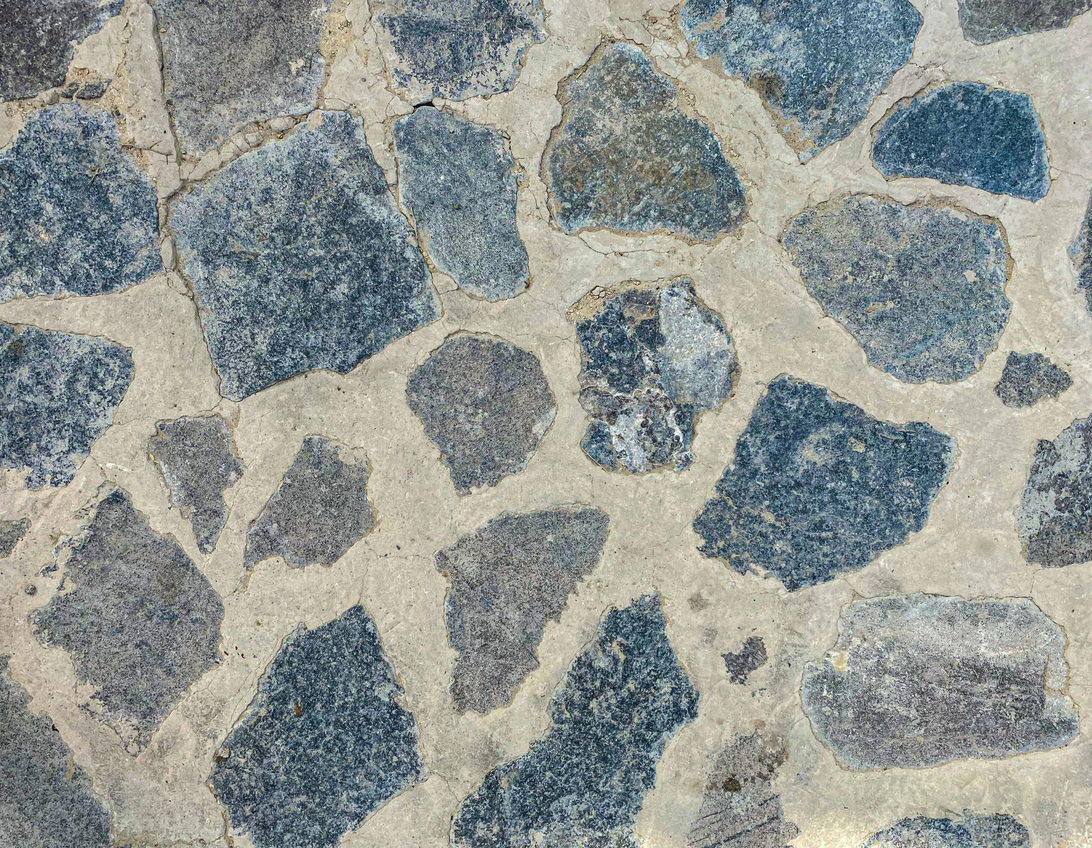 a po of a blue, grey and white textured stone