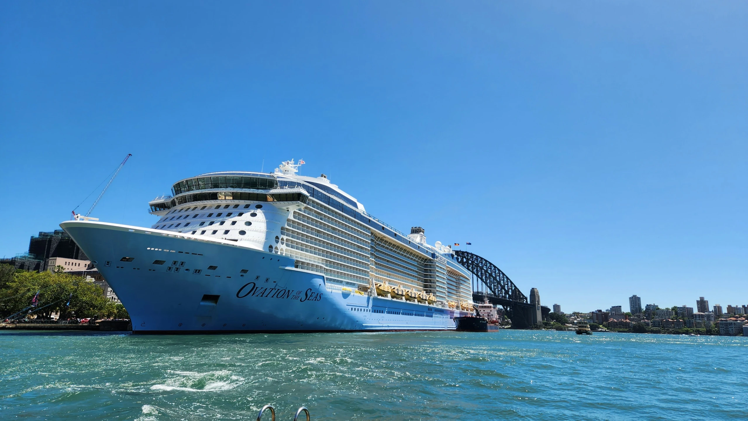 a large cruise ship is moored to dock on a sunny day