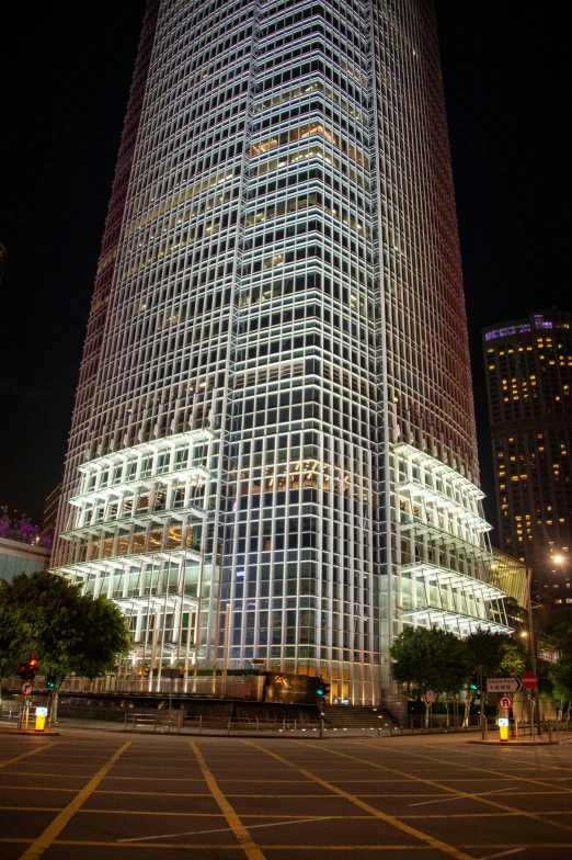 the building is surrounded by glass and steel