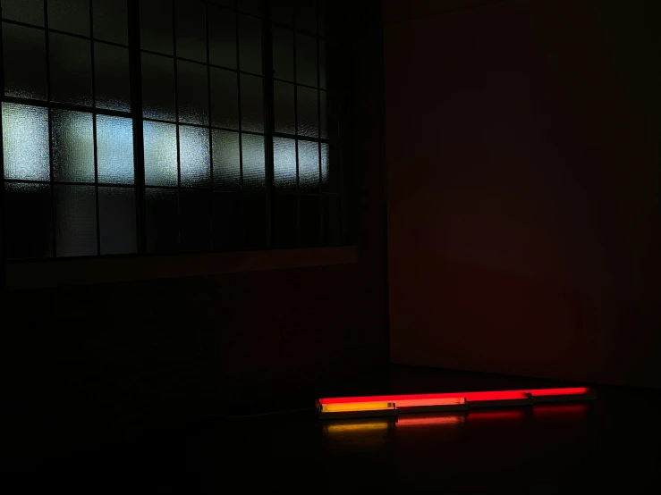 a wall with several red lights around it