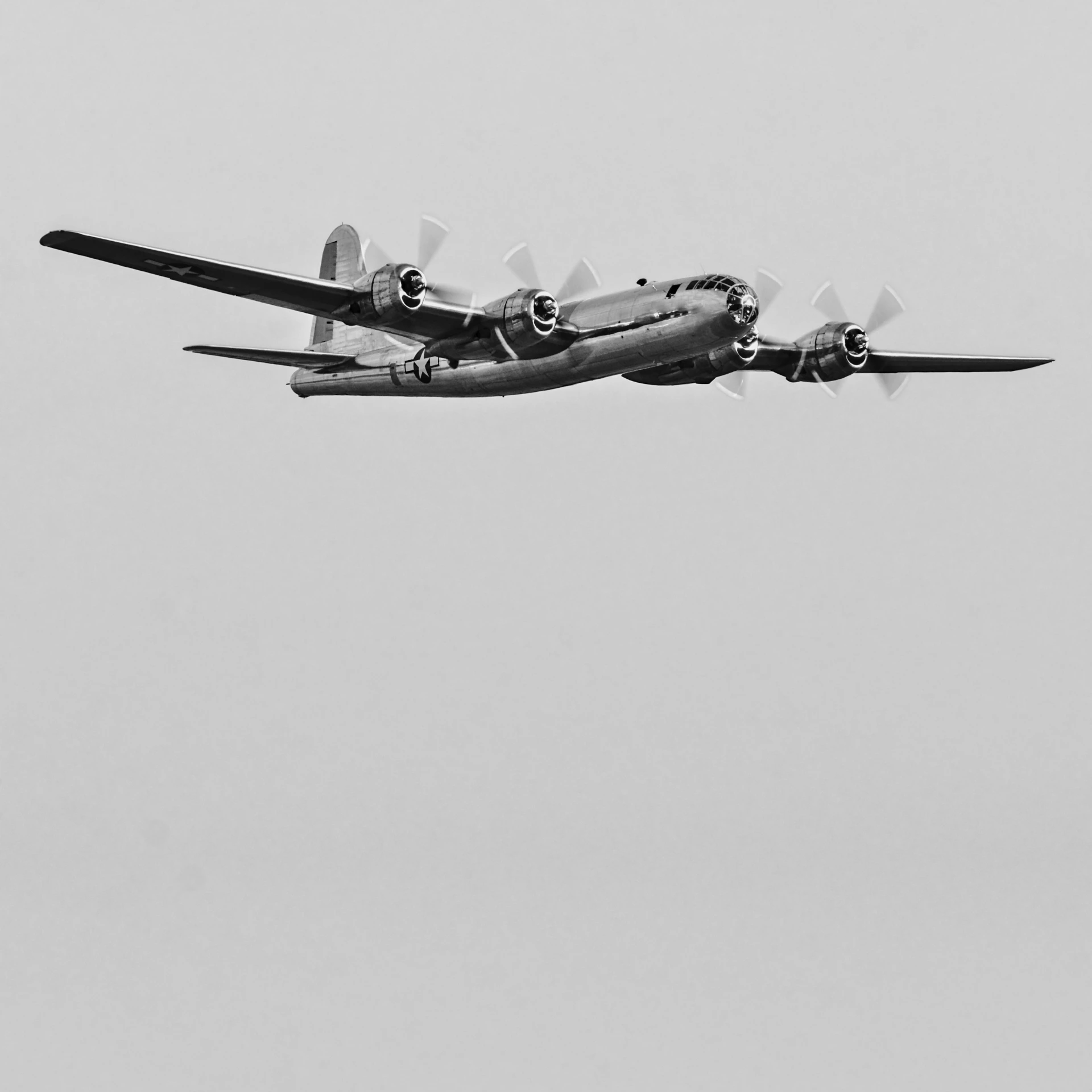 two old planes flying in the sky on cloudy day