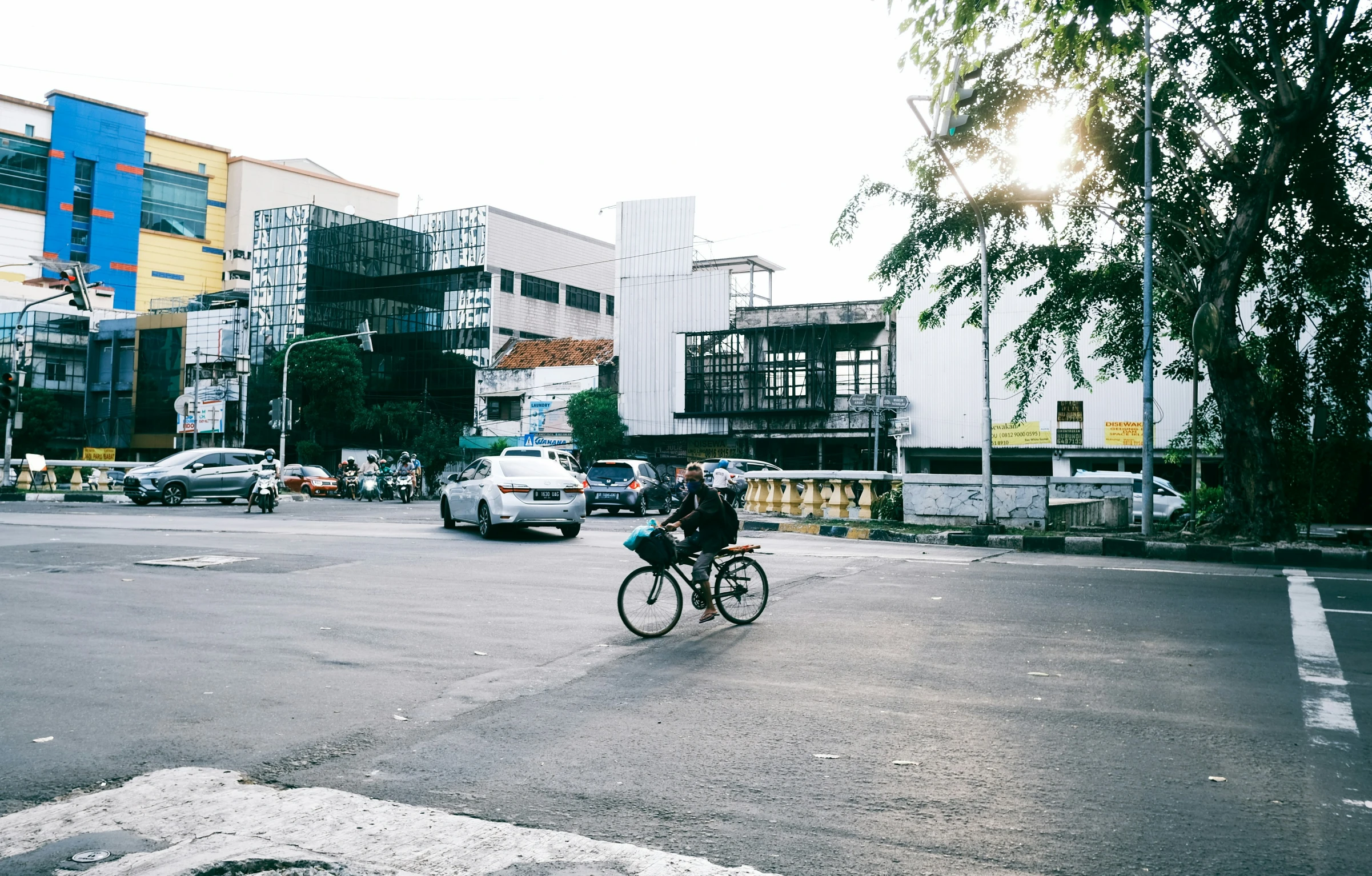 a man is riding a bike down a road