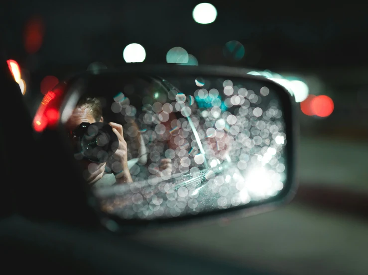 a rear view mirror showing the side mirror of a car