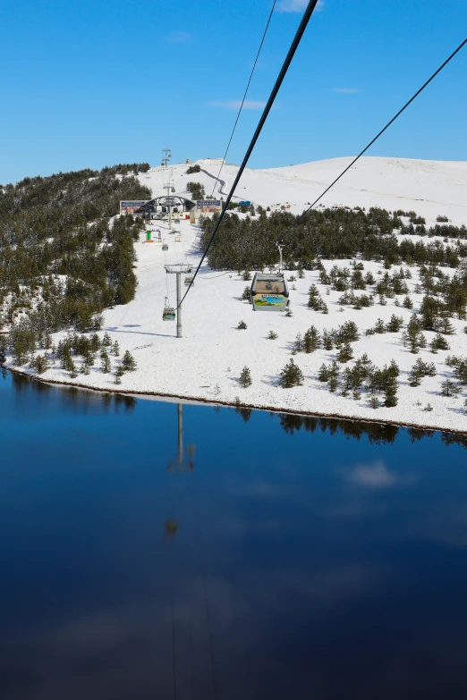 a snow covered hillside on top of a hill