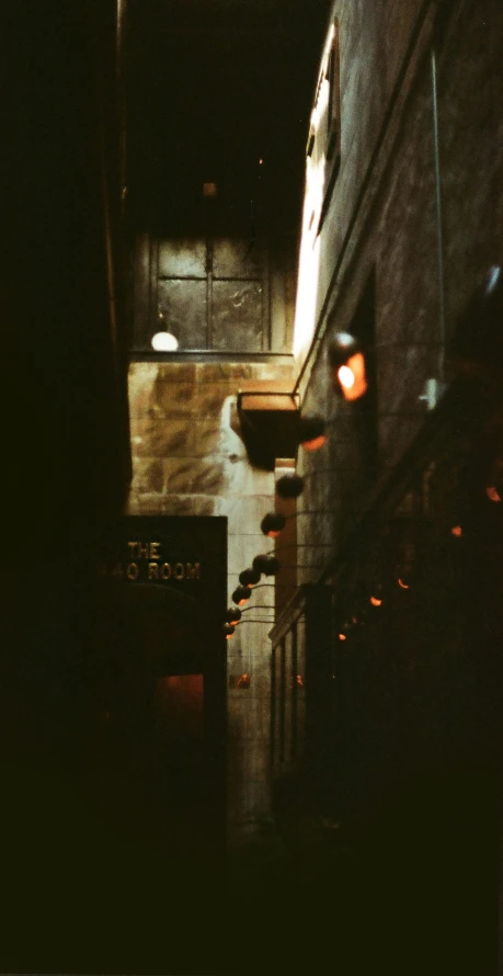 dark hallway with small window, lights and steps