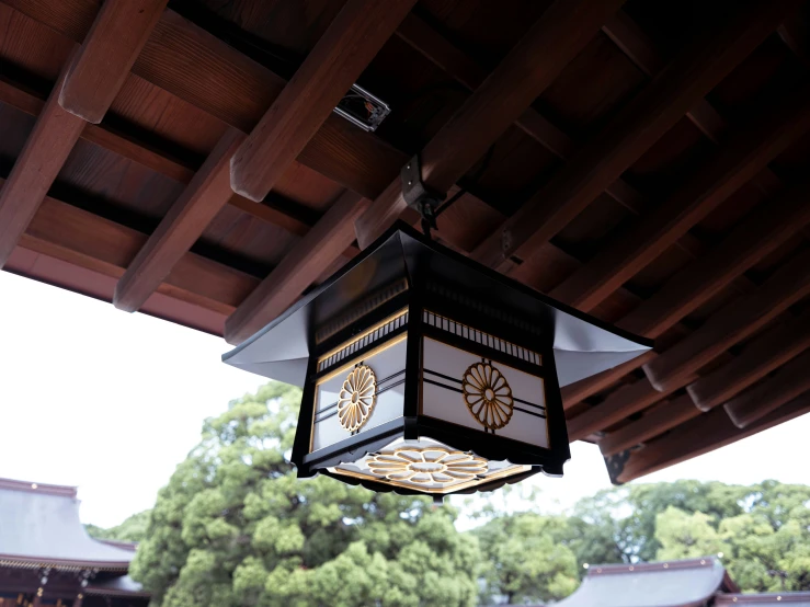 a lantern hanging from the roof of a building