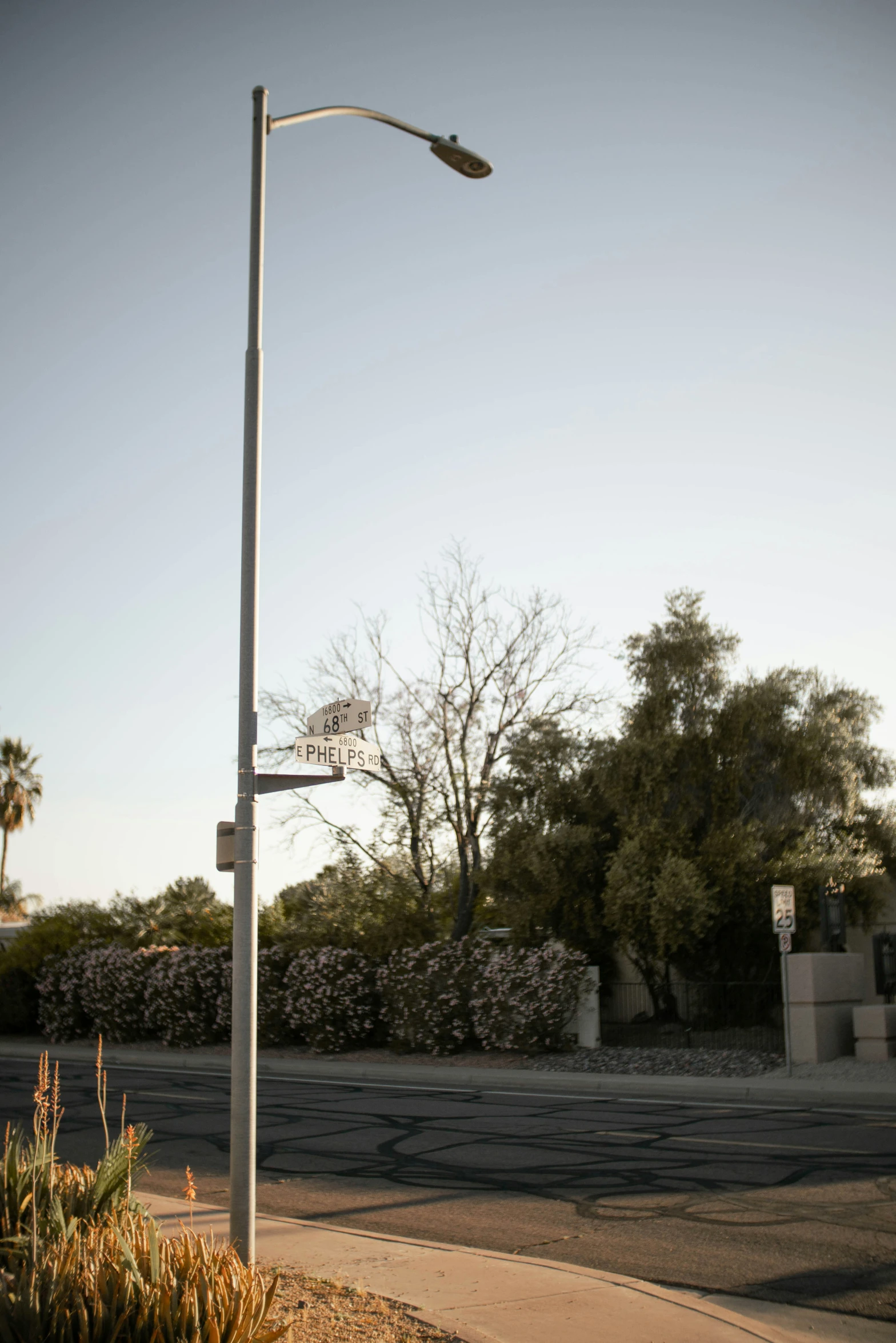 a street lamp sitting next to the road