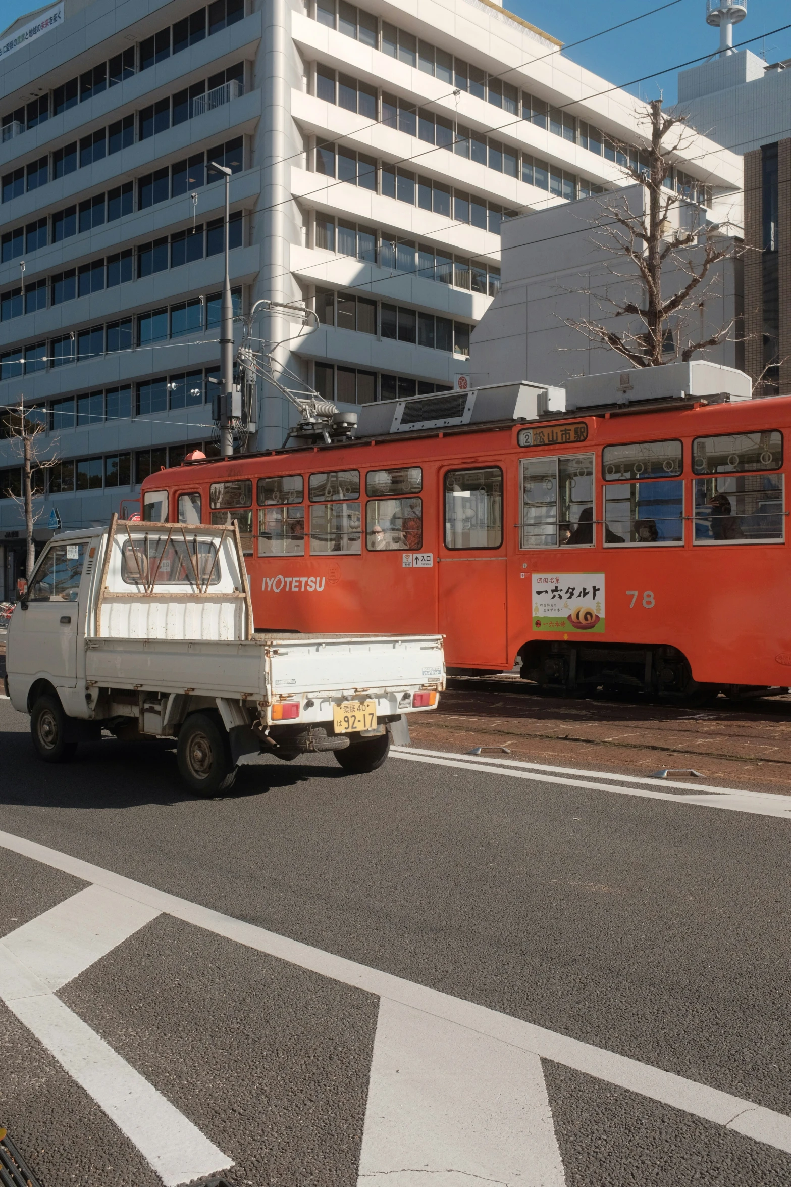 a street scene with two vehicles and building