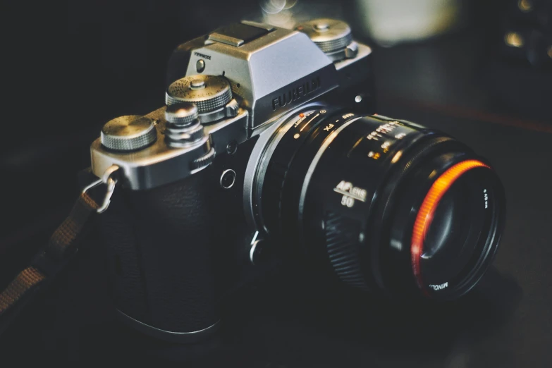 an old camera is sitting on top of the table