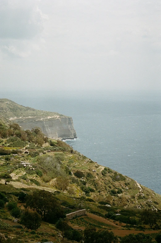 an ocean landscape with an island in the middle