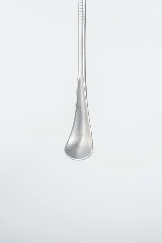 an illustration of a metal spoon being held up