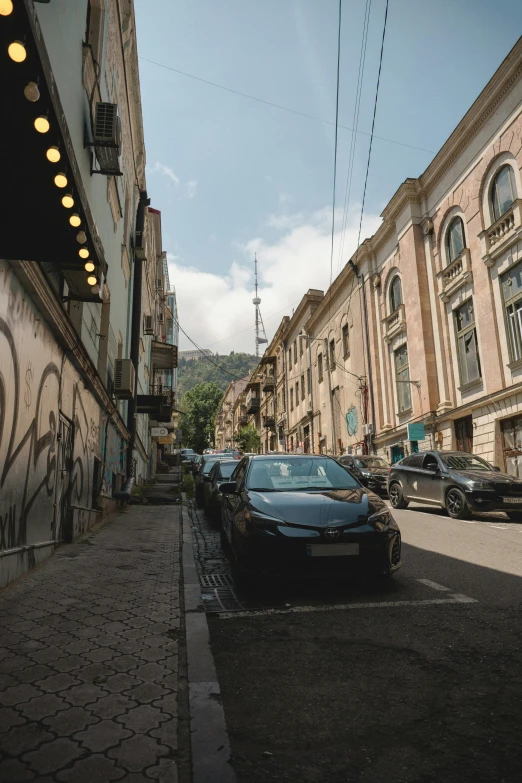 the cars are parked on the side of the street