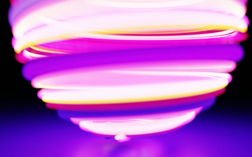 a large glass object in a purple background