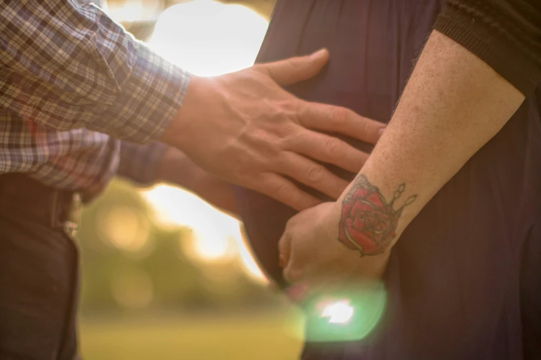 a couple holding hands are holding each other