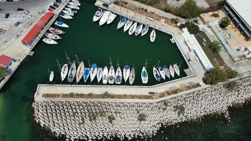 a large group of boats are docked at a dock