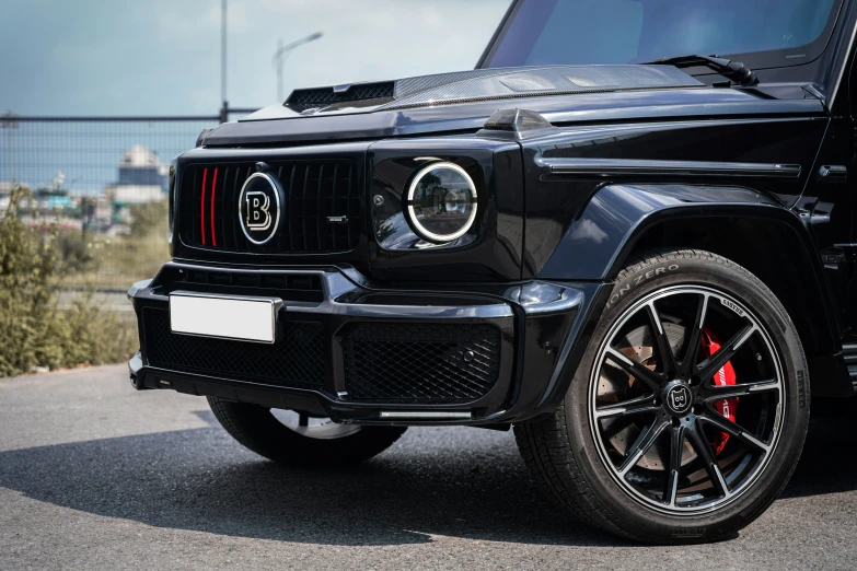 a black jeep is shown from the front end